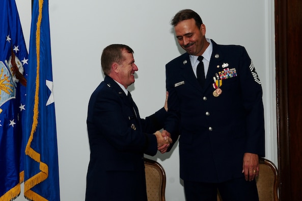 ANDERSEN AIR FORCE BASE Guam:  Gen. Phil Ruhlman, 36th Wing commander,  congratulates 36th Wing Command Chief Master Sergeant Saniford D. "Bud" Andree, Jr., on his career and achievements during a retirement ceremony,Jan. 8 at the Sunrise Conference Center. Before retiring, Chief Andree hands over the reins of command chief ofthe 36th Wing to Chief Master Sgt. Allen Mullinex. (U.S. Air Force photo by Airman 1st Class Jeffrey Schultze)