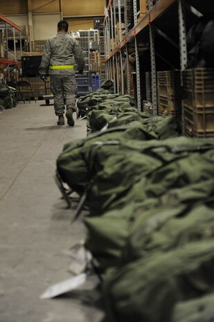 NELLIS AIR FORCE BASE, Nev. -- A 99th Logistics Readiness Squadron Airman  checks mobility bags at the deployment center during an operational readiness exercise Dec. 21. The 99th Air Base Wing is preparing for an operation readiness inspection Jan 25-29. (U.S. Air Force photo by Airman 1st Class Bret Clashman)
