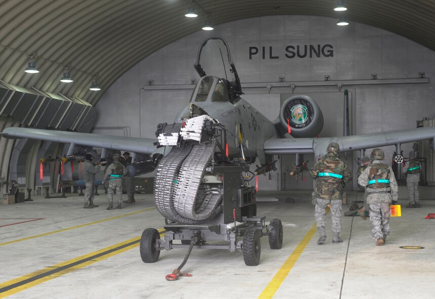 51st Maintenance Squadron Airmen load munitions onto an A-10 aircraft in a 25th Fighter Squadron hangar during Exercise Beverly Bulldog 10-01 on Osan Air Base, Republic of Korea Jan. 11. (U.S. Air Force photo/Senior Airman Stephenie Wade)
