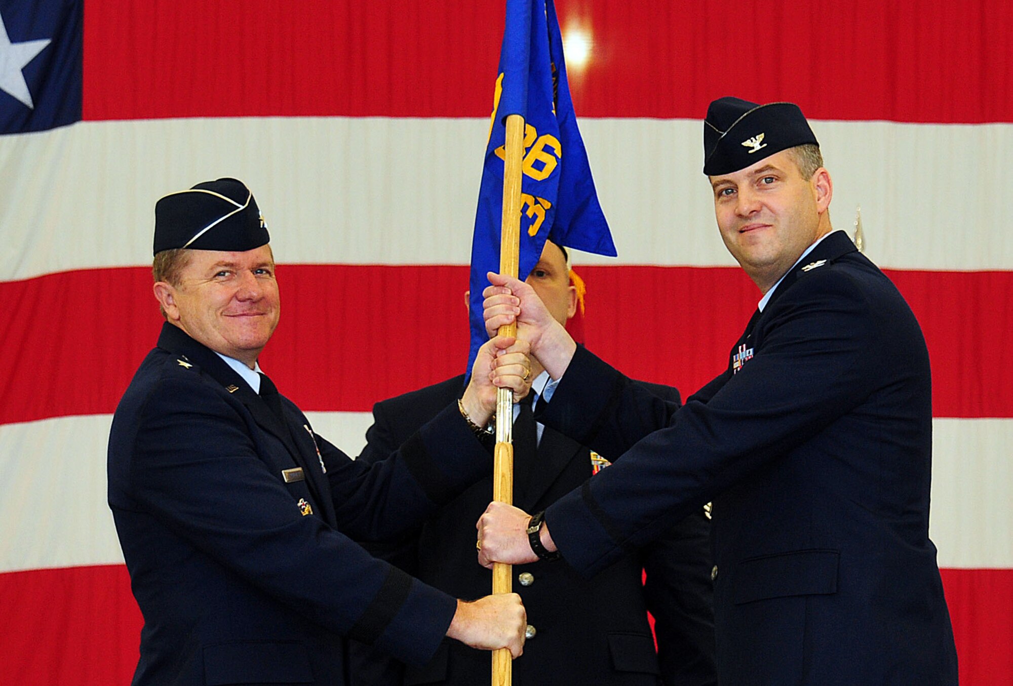 ANDERSEN AIR FORCE BASE, Guam - Col. Jeff Vandenbussche assumes command of the 36th Operations Group from General Phil Ruhlman, 36th Wing commander, in Hangar 6 on Jan. 11. Colonel Vandenbussche took over command from the 36th Wing Vice Commander Colonel Tod Fingal, who was serving in both roles.  (U.S. Air Force photo by Airman 1st Class Julian North)