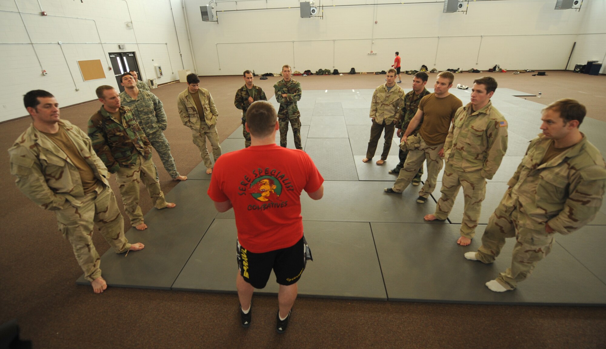 MOODY AIR FORCE BASE, Ga. -- Staff Sgt. Justin McCaffrey, 38th Rescue Squadron Survival, Evasion, Resistance, and Escape specialist NCO in-charge, gives a safety briefing to members from the 38 RQS who are enrolled in the Modern Army Combatives Program training here Jan. 7. Safety is paramount during this type of training because the techniques that are taught are used in hand-to-hand combat. (U.S. Air Force photo by Airman 1st Class Benjamin Wiseman)
