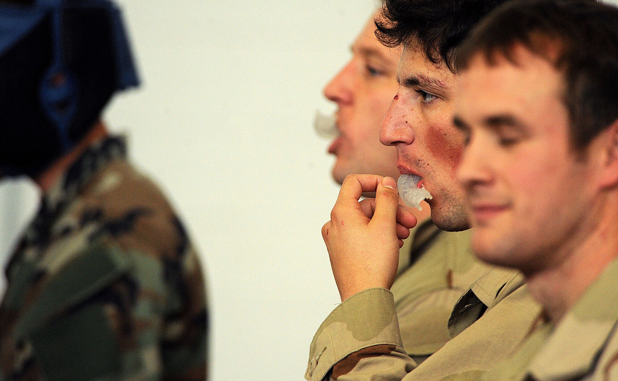 MOODY AIR FORCE BASE, Ga. -- Senior Airman Alejandro Serrano, a pararescueman from the 38th Rescue Squadron, observes other pararescuemen as they participate in the final stages of  the Modern Army Combatives Program training here Jan. 7. PJs must be certified and experienced in the MAC-P training should they encounter a situation where they are required to use hand-to-hand combat techniques. (U.S. Air Force photo by Airman 1st Class Joshua Green)