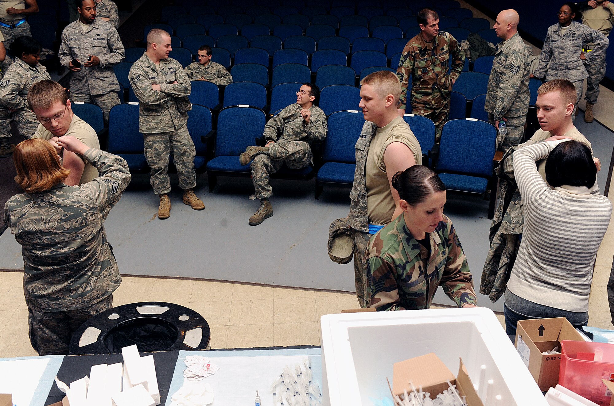 MOODY AIR FORCE BASE, Ga. -- Airmen from the 23rd Medical Group administer the H1N1 influenza vaccination to Airmen during a mass immunization event here Jan. 8. (U.S. Air Force photo by Airman 1st Class Joshua Green)