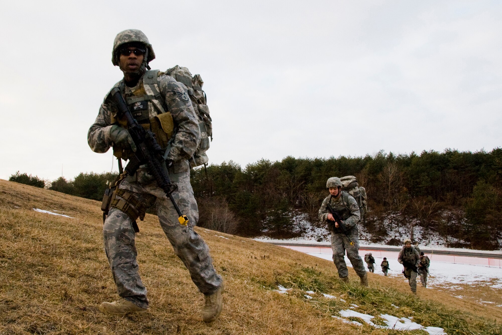 MISAWA AIR BASE, Japan -- Staff Sgt. Michael Overton, 35th Civil Engineer Squadron Explosive Ordinance Disposal craftsman, leads a tactical formation during a ruck march Jan. 8 at Ski Hill. Spacing is key during tactical formations; if someone faces danger, the rest of the formation can assess the situation and respond accordingly at a reasonable distance. (U.S. Air Force photo/Senior Airman Jamal D. Sutter)