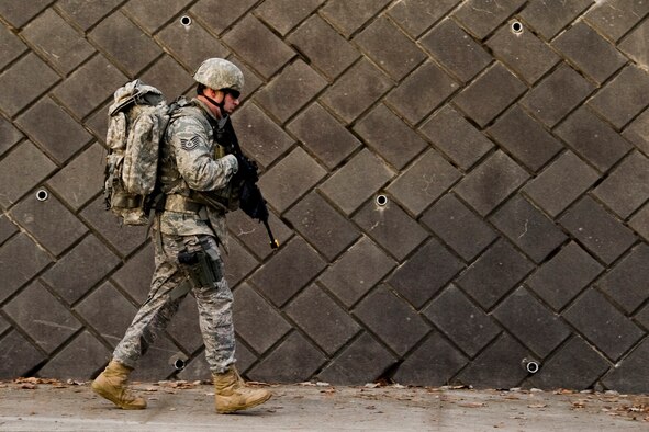 MISAWA AIR BASE, Japan -- Tech. Sgt. Jeffery Hansen, 35th Civil Engineer Squadron Explosive Ordnance Disposal technician, marches along Concrete Canyon Jan. 8. Ruck marches are one way Air Force EOD units train physically for the demands of the job. (U.S. Air Force photo/Senior Airman Jamal D. Sutter) 

