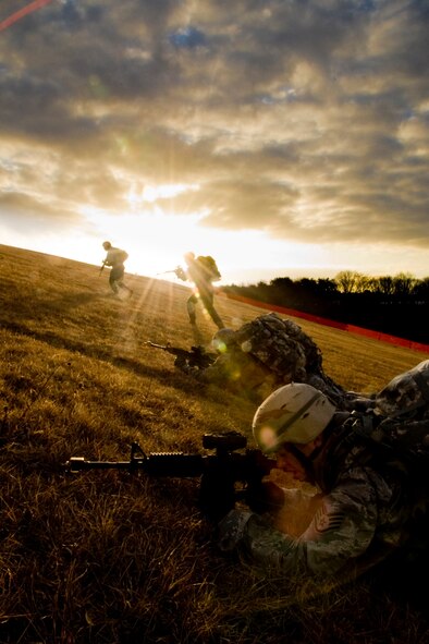 MISAWA AIR BASE, Japan -- Members of the 35th Civil Engineer Squadron Explosive Ordinance Disposal flight conduct a bounding drill during a ruck march Jan. 8 while ascending Suicide Hill. Members of the flight said Suicide Hill was among the toughest parts of the march due to its abrupt angle. (U.S. Air Force photo/Senior Airman Jamal D. Sutter)