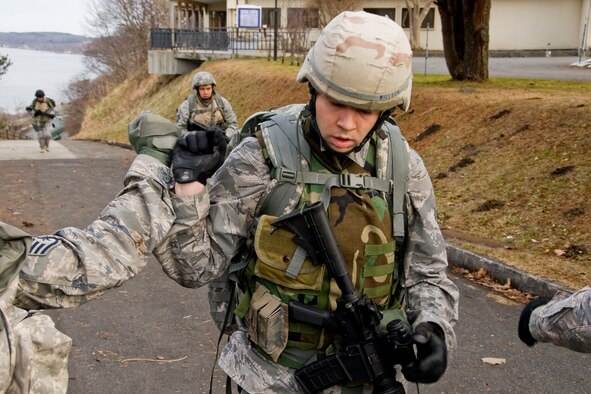 MISAWA AIR BASE, Japan -- Staff Sgt. Paul Willson, 35th Civil Engineer Squadron Explosive Ordnance Disposal technician, completes a four-mile ruck march Jan. 8. Including a rucksack, body armor, helmet and weapon, members of the EOD flight carried more than 100 pounds of gear during the march. (U.S. Air Force photo/Senior Airman Jamal D. Sutter) 

