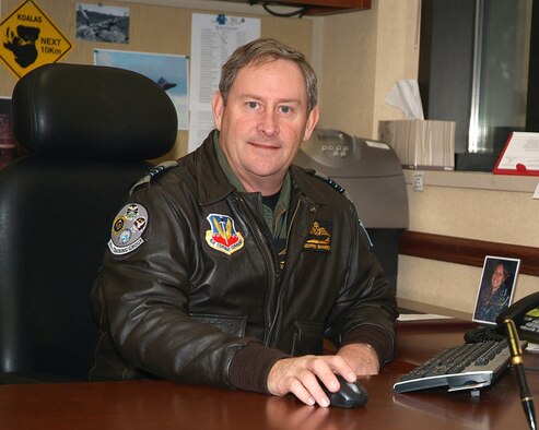 HURLBURT FIELD, Fla. -- Royal Australian Air Force Wing Commander Geoffrey Shambrook works at his desk recently at the 505th Training Group. Wing Commander Shambrook was attached to the group, part of the 505th Command and Control Wing, for three years as an exchange officer. He returns to his native Australia this month. (Photo by Keith Keel/U.S. Air Force) 