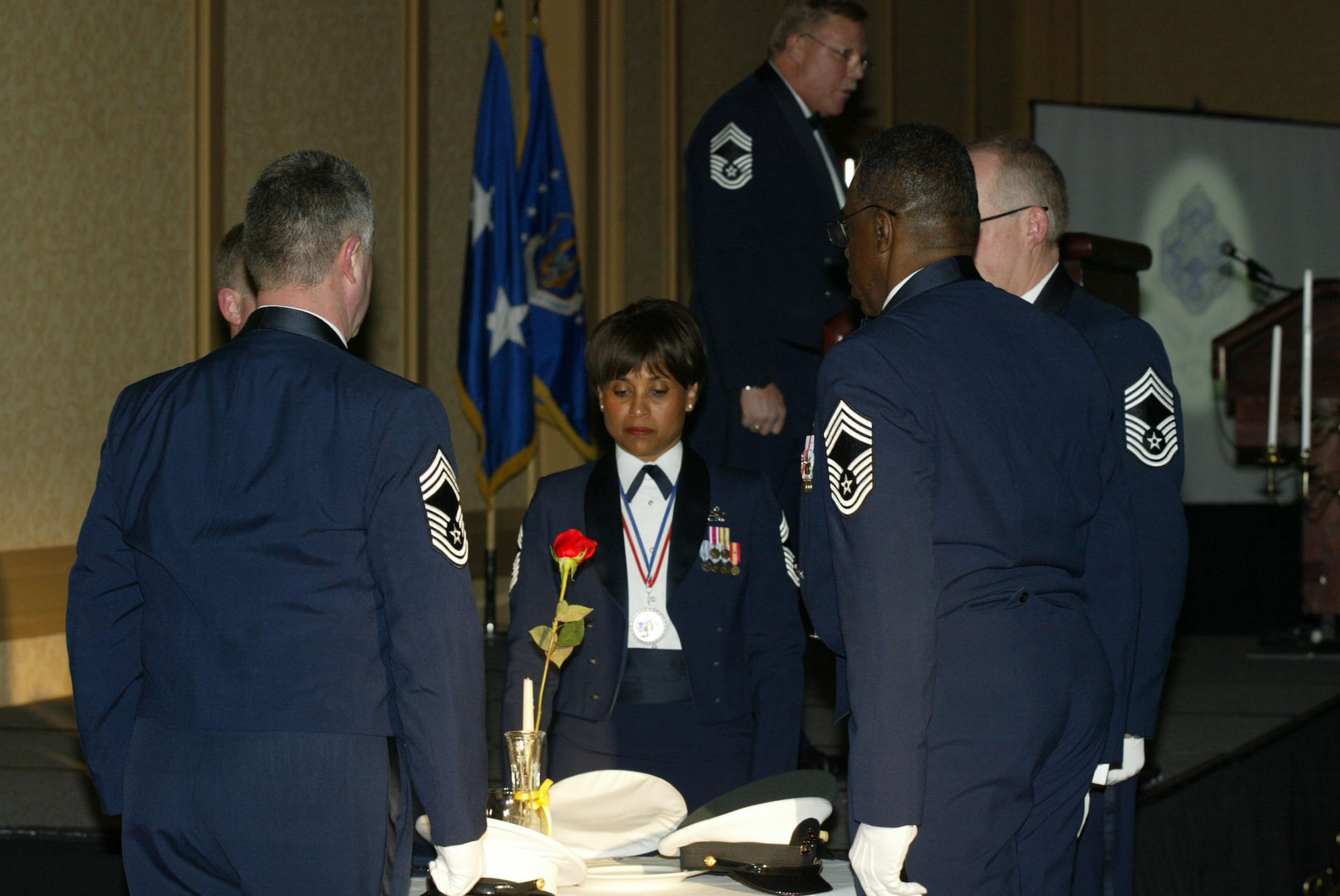 The 2010 Dobbins Chief Master Sergeant Inductees perform the POW/MIA Ceremony as Chief Master Sgt. Les Davy, 22nd Air Force, provides narration. Dobbins inducted five Chiefs during the ceremony held Jan. 9 at the Renaissance Waverly. (U.S. Air Force photo/Don Peek)