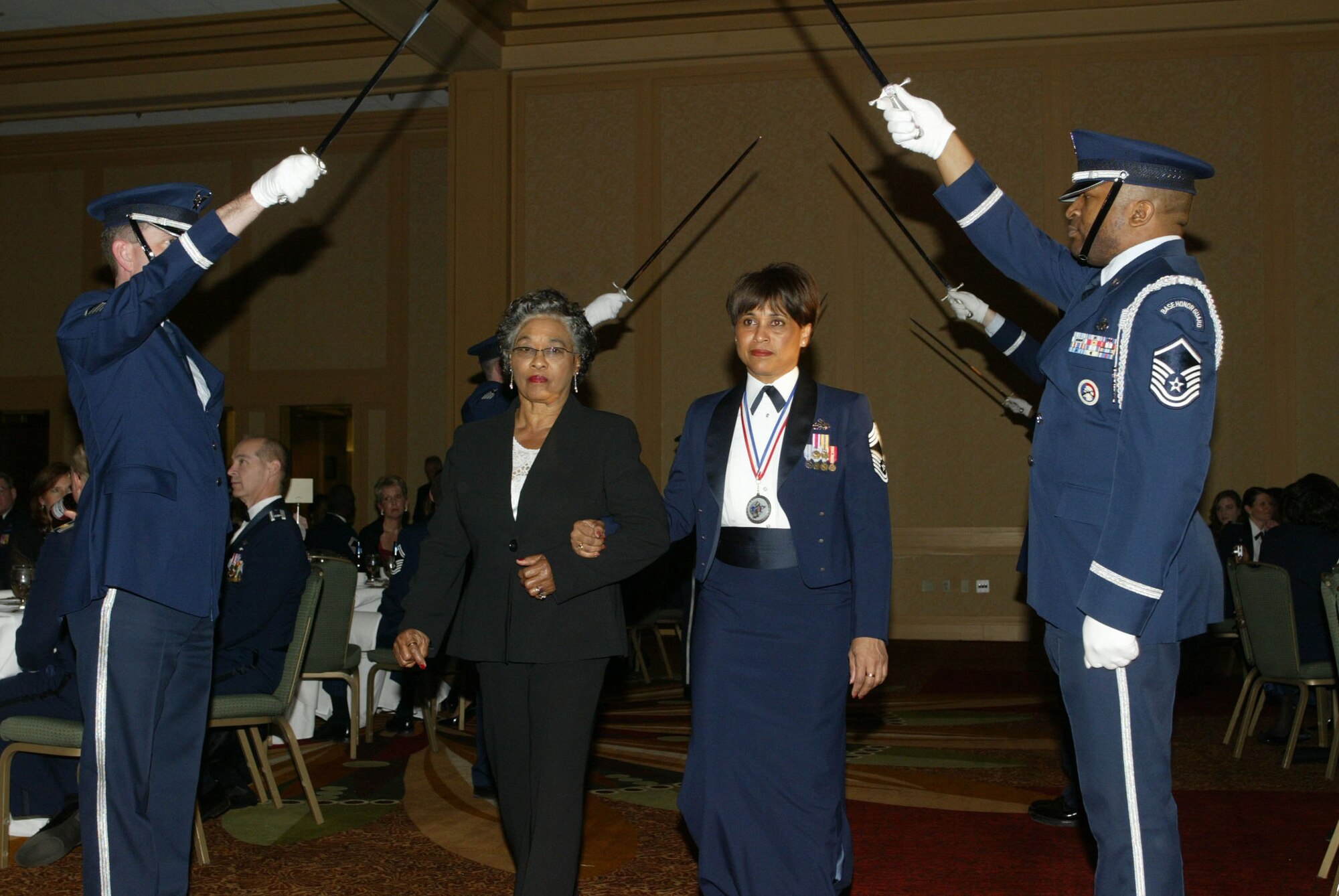 Chief Master Sgt. Wanda Gail Greene and her mother, Gennie Greene, enter the ballroom marking the beginning of the 2010 Chiefs Recognition Ceremony held Jan. 9 at the Renaissance Waverly. Chief Greene is the Group Superintendent for the 622nd Regional Support Group. (U.S. Air Force photo/Don Peek)