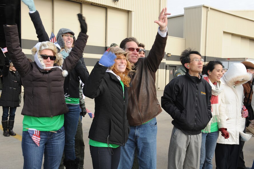 Family members of Captain Justin Elliott's, 335th Fighter Squadron pilot, wave as he taxis to a parking spot on Seymour Johnson Air Force Base, N.C., Jan. 8, 2009. Pilots and weapon system operators from the 335th Fighter Squadron and 336th Fighter Squadron flew the 18 returning F-15E Strike Eagles more than 16,000 hours in Afghanistan supporting Operation Enduring Freedom. (U.S. Air Force photo/Senior Airman Whitney Lambert)