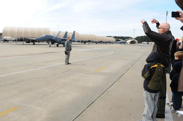 Family and friends cheer on 335th Fighter Squadron pilots and weapon system operators as they return home to Seymour Johnson Air Force Base, N.C., Jan. 8, 2009.  The Airmen deployed to Afghanistan in support of Operation Enduring Freedom. (U.S. Air Force photo/Senior Airman Whitney Lambert)