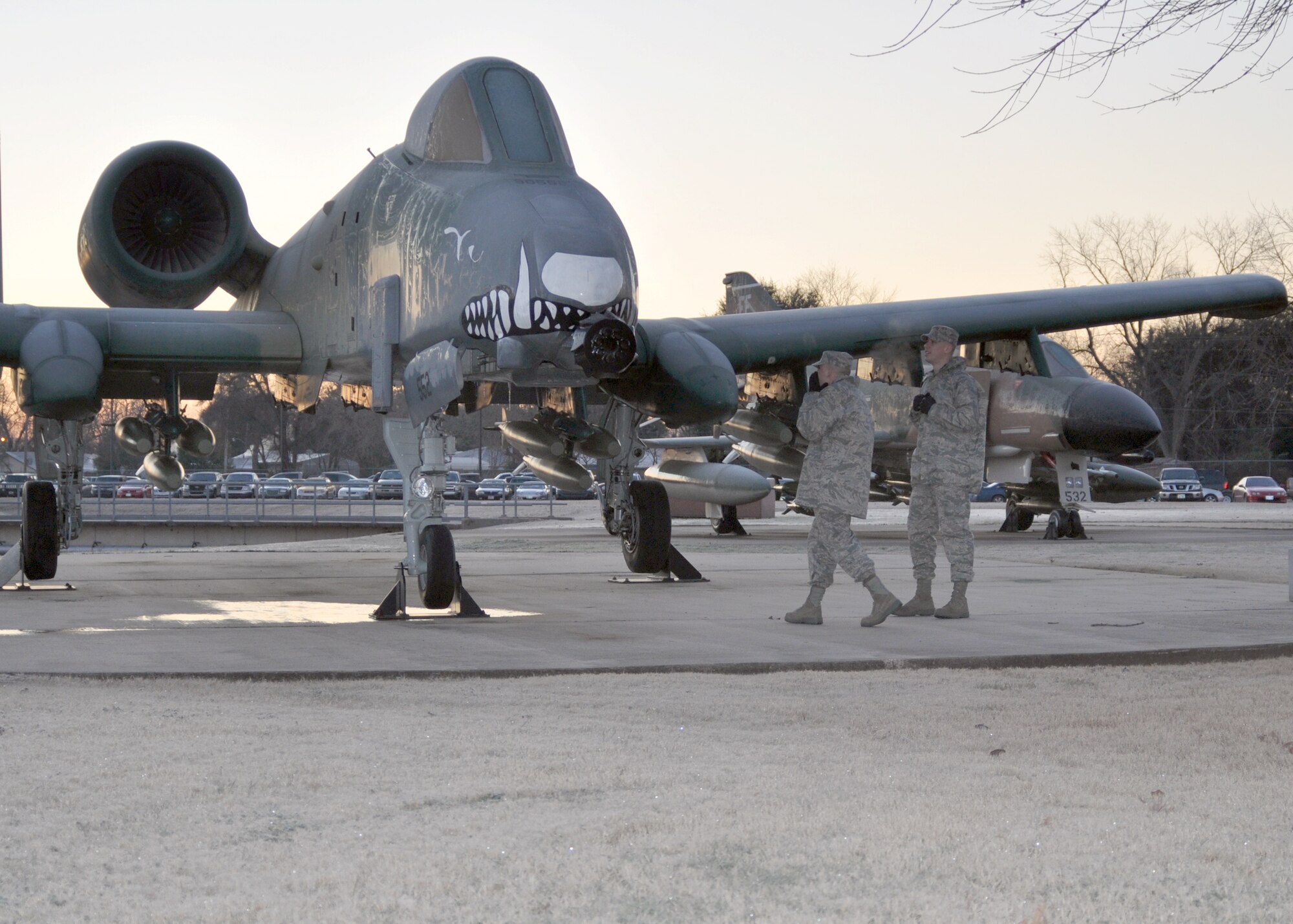 Airman 1st Class Andrew Theis and Airman 1st Class Joseph McCubin, both aircraft structural maintenance technicians for the 917th Aircraft Maintenance Squadron at Barksdale Air Force Base, La., look over an A-10 Thunderbolt II static display in front of the 917th Headquarters here during their first Unit Training Assembly (UTA) weekend Jan. 9, 2010. Being new to the 917th Wing, they braved 13 mph winds and a 15-degree freeze while exploring Barksdale. Parts of Louisiana, including Barksdale, spent most of the weekend in teen-degree temperatures after a hard freeze warning was issued for most of the Southern United States. (U.S. Air Force Photo/Senior Airman Crystal Marie Jordan)