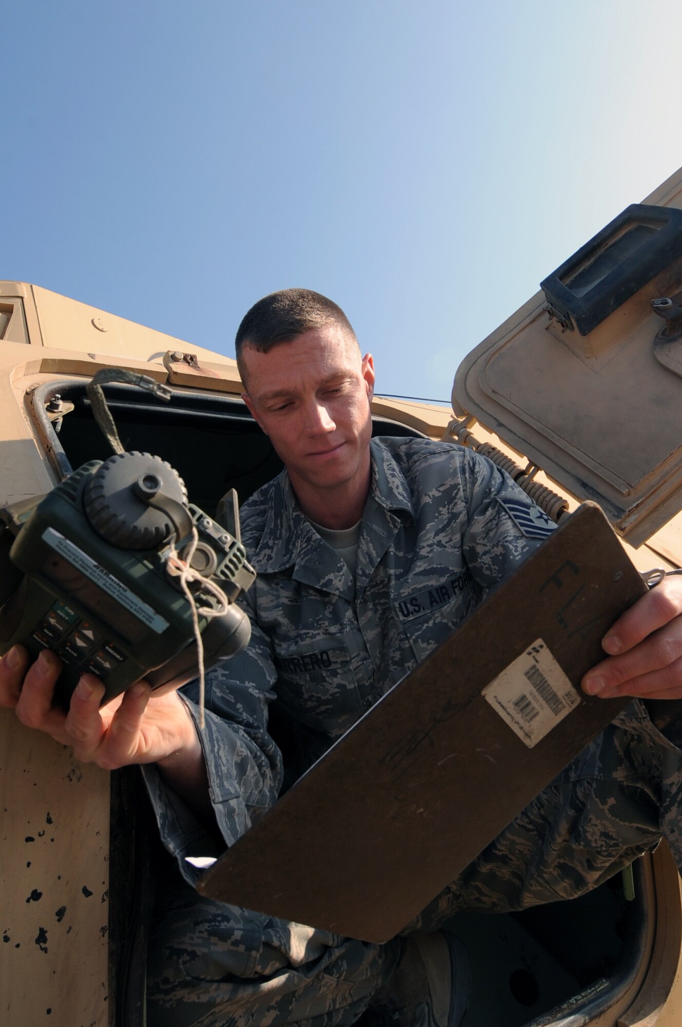 Tech. Sgt. Michael Marrero, 732nd Expeditionary Logistics Readiness Squadron lead inspector, verifies the serial number on a Defense Advanced Global Position System Receiver found in a vehicle during an inspection at Joint Base Balad, Iraq, Jan. 6, 2010. The RPAT mission supports the responsible drawdown of forces from Iraq by reallocating equipment no longer needed in country to other areas, such as Afghanistan. (U.S. Air Force photo/Senior Airman Brittany Y. Bateman/Released)