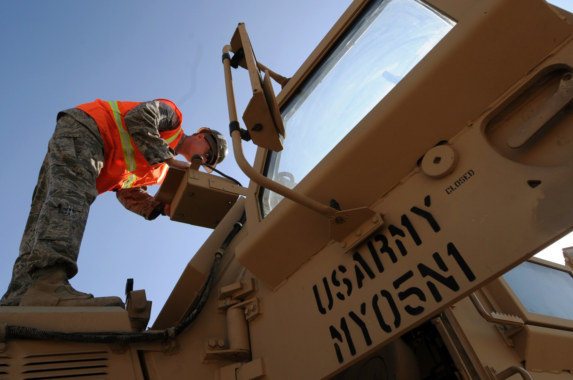 Tech. Sgt. Michael Marrero, 732nd Expeditionary Logistics Readiness Squadron lead inspector, examines a Mine Resistant Ambush Protected vehicle at Joint Base Balad, Iraq, Jan. 6, 2010. Inspectors check for cleanliness, verify serial numbers and ensure all hazardous material is removed. (U.S. Air Force photo/Senior Airman Brittany Y. Bateman/Released)
