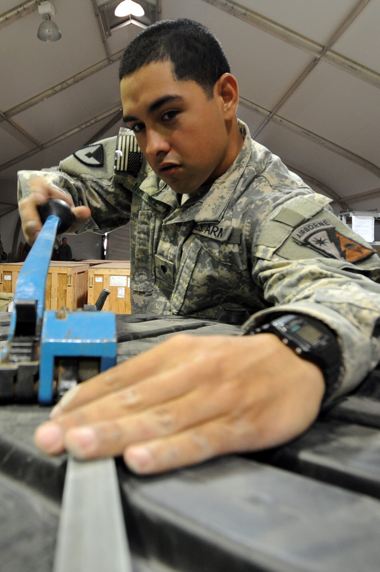 Specialist Edward Martinez, 249th Quartermaster Company Redistribution Property Assistance Team inspector, bands a tri-wall package to be shipped back to the United States at Joint Base Balad, Iraq, Jan. 6, 2009. The primary RPAT mission is to facilitate the expedient turn-in of all excess in-theater equipment, improve accountability and enable asset visibility of the received equipment. (U.S. Air Force photo/Senior Airman Brittany Y. Bateman/Released)
