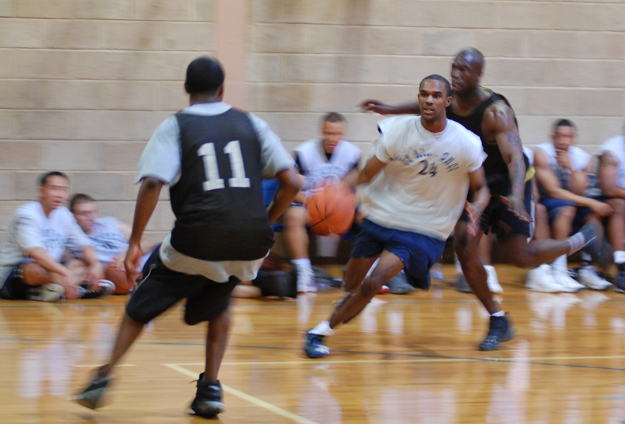 U.S. Air Force Airman Dinote Hall, 387th Expeditionary Security Forces Squadron, drives to the basket for a lay-up and one during a game against U.S. Army Soliders Jan. 10, 2010 at an air base in Southwest Asia. The Air Force beat the Army 44-37. The Soliders are stationed at a logistics support area nearby the air base. (U.S. Air Force photo by Staff Sgt. Lindsey Maurice/Released)