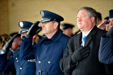Secretary of the Air Force Michael Donley (right), and Gen. Stephen R.
Lorenz pay respect to the national anthem during the Basic Military Training graduation ceremony Jan. 8, 2010, at Lackland Air Force Base, Texas. The ceremony was held in sub-freezing temperatures on the parade grounds. General Lorenz is the  Air Education and Training Command commander. (U.S. Air Force photo/Lance Cheung)
