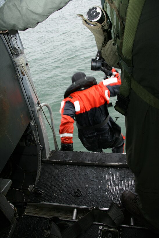 Staff Sgt. Ryan C. Smith, Marine Transport Squadron 1’s search and rescue non commissioned officer in charge, jumps into the freezing Atlantic waters during search and rescue training missions just off the coast of eastern North Carolina, Jan. 12. The mission of the exercisew was to rescue the supposed stranded victim Gunnery Sgt. William B. Cordoza, VMR-1’s quality assurance chief, with the help of an HH-46E SAR helicopter.