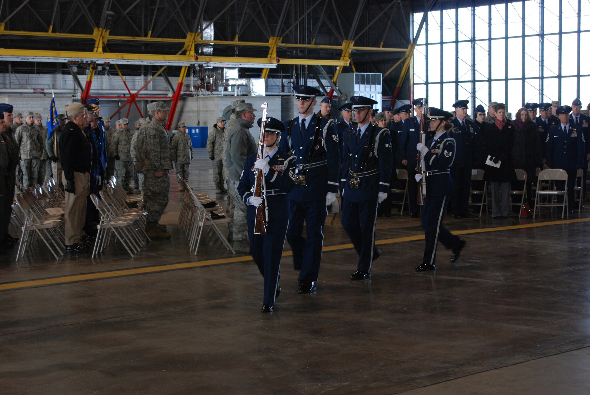 Members of the 932nd Airlift Wing's Honor Guard at Scott AFB, Ill. pass by personnel attending the memorial service Jan. 9 for the 932nd Airlift Wing's Tech. Sgt. Anthony Campbell. Sergeant Campbell was killed in action Dec. 15 in Afghanistan. (U.S. Air Force photo/Tech. Sgt. Gerald Sonnenberg)