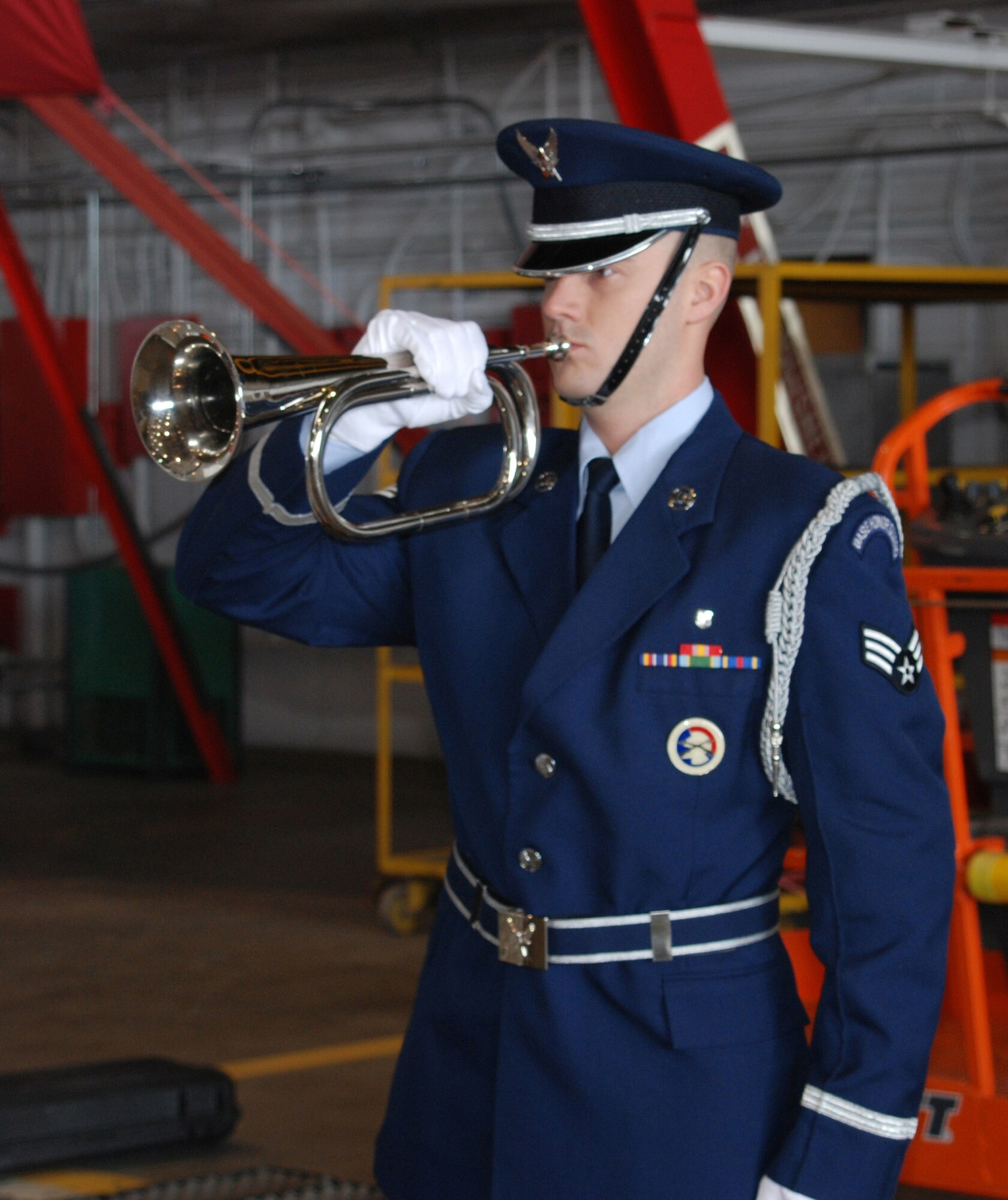 A bugler from the Honor Guard at Scott AFB, Ill. plays taps in honor of the 932nd's Tech. Sgt. Anthony Campbell during his memorial service Jan. 9. Sergeant Campbell was killed in action Dec. 15 in Afghanistan. (U.S. Air Force photo/Tech. Sgt. Gerald Sonnenberg)