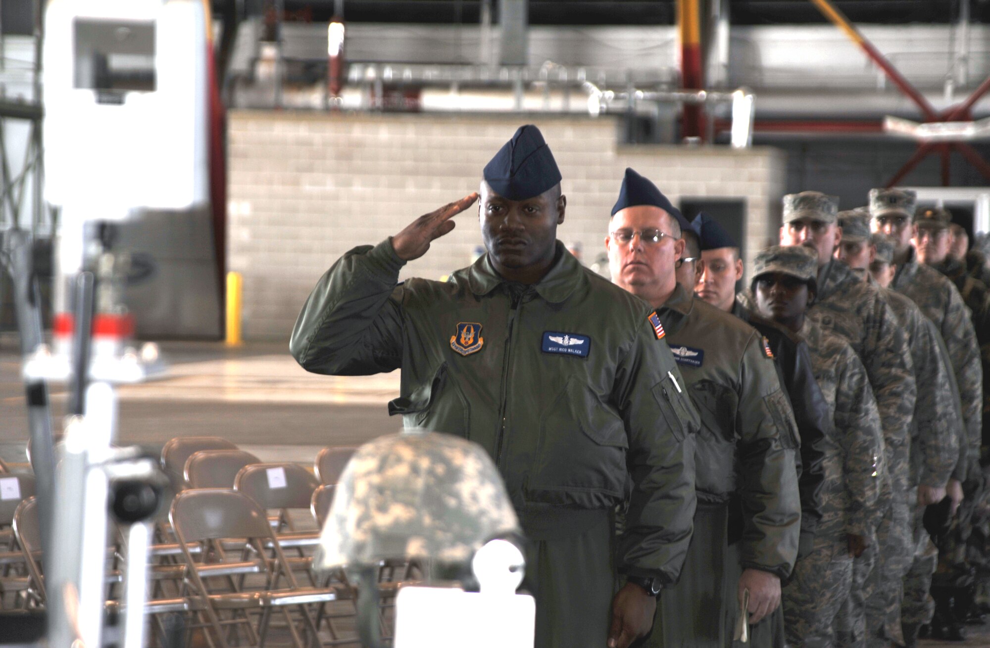 Master Sgt. Rico Walker presents a final salute in memory of Tech. Sgt. Anthony Campbell, Jr., who was killed December 15 in Afghanistan during Operation Enduring Freedom.  The 932nd Airlift Wing held a memorial service during their January drill weekend in honor of the slain reservist.  (U.S. Air Force photo/Maj. Stan Paregien)