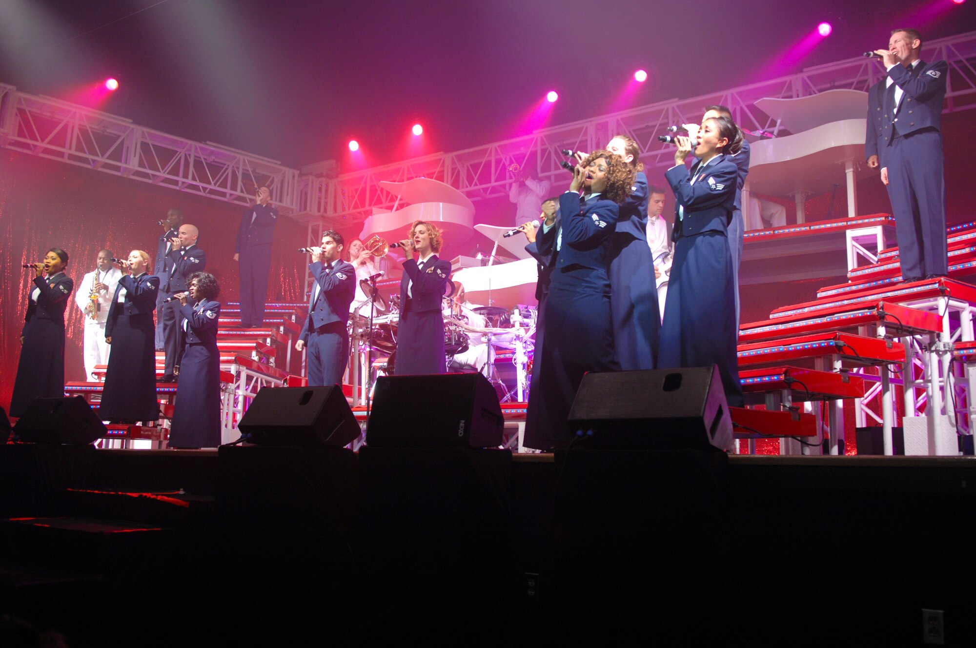 ELMENDORF AIR FORCE BASE, Alaska -- The Tops in Blues performers sing, "God Bless the USA" for their traditional finale. The Tops in Blue are the Air Force's premier entertainment showcase. (U.S. Air Force photo/ Airman 1st Class Jack Sanders)
