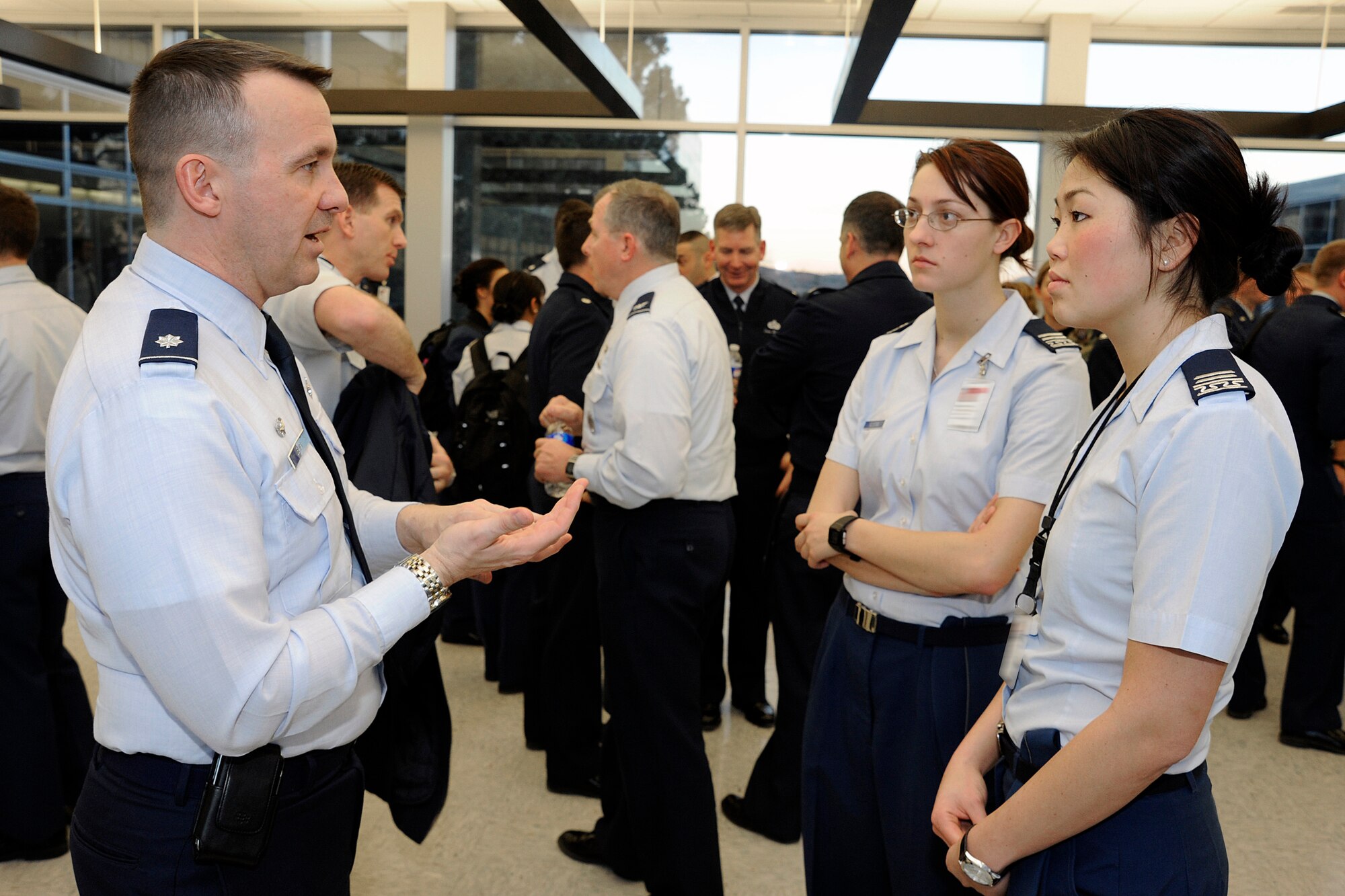 Lt. Col. Donald Lewis speaks with Cadets 1st Class Lucy McMinn and Julie Song following a cyberspace career panel at the Air Force Academy in Colorado Springs, Colo., Jan. 11, 2010. Colonel Lewis is commander of the 690th Network Services Squadron at Vandenberg Air Force Base, Calif. Cadets McMinn and Song are assigned to Cadet Squadrons 01 and 13. (U.S. Air Force photo/Mike Kaplan)