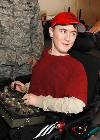 Matthew Welch guides a remote controlled Remotec Transport Robot in the Explosive Ordinance Disposal shop December 22, 2009 at Travis Air Force Base. The robots are used to aid EOD team members in the dismantling of explosive devices.  The experience was part of a "Make a Wish" visit to Travis Air Force Base requested by Matthew. (U.S. Air Force photo by Civ/Amanda Lopez)