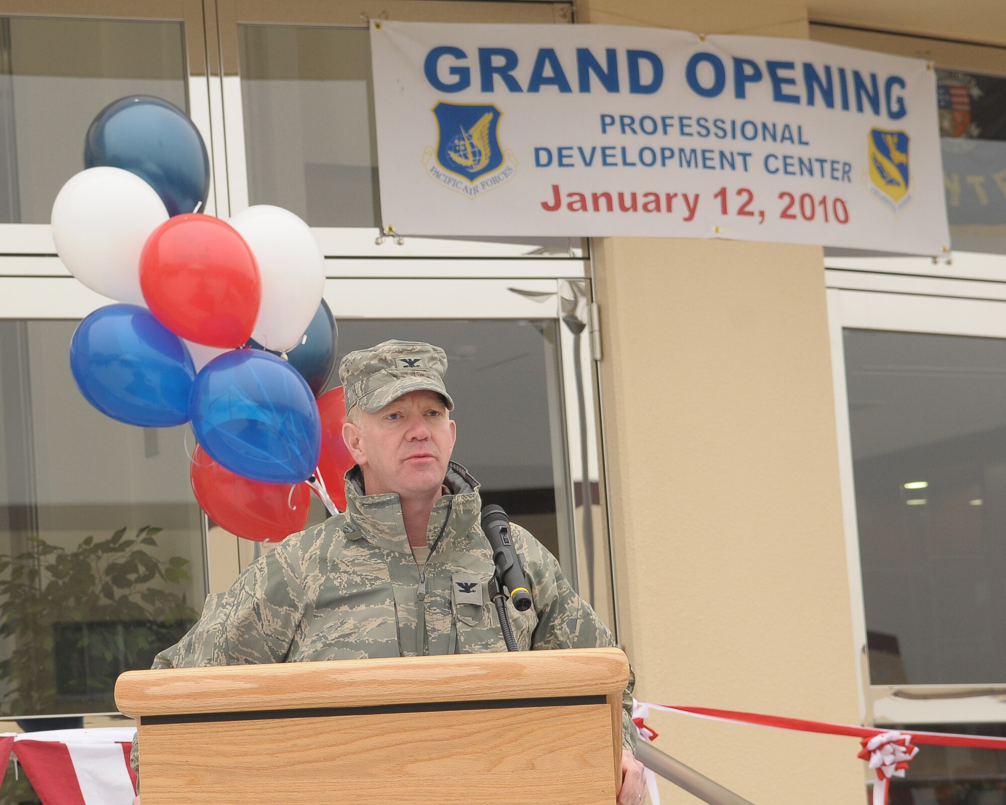 YOKOTA AIR BASE, Japan -- Col. Mark Hicks, 374th Airlift Wing commander, says a few words at the opening ceremony of the new Professional Development Center Jan. 12. The new building offers bigger classrooms, more amenities, and a better location for students. (U.S. Air Force photo/Airman 1st Class Sean Martin) 