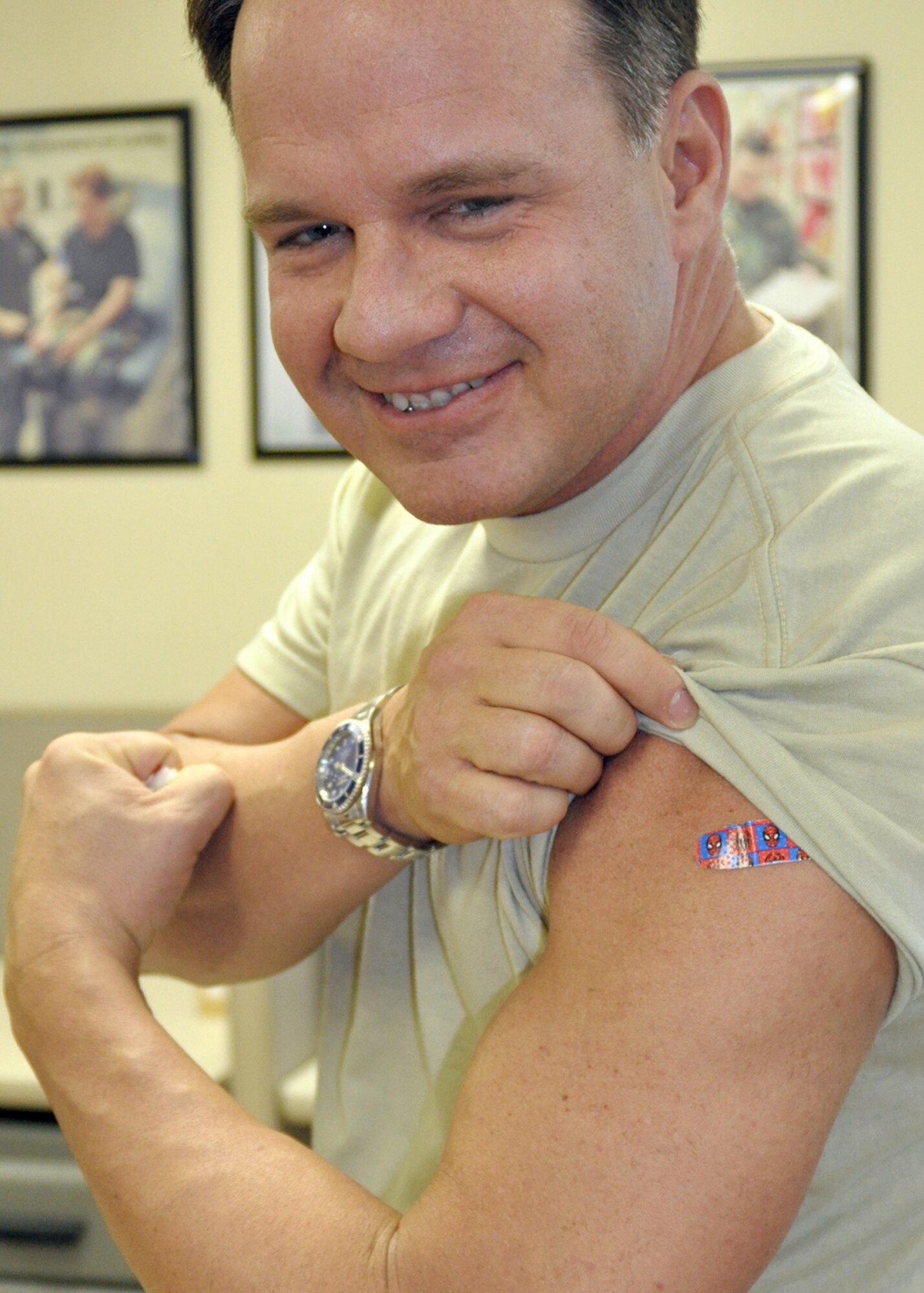 Senior Master Sgt.  Michael Doelling, a medical services attendant for the 917th Medical Squadron on Barksdale Air Force Base, La., sports his Spider Man Band-Aid after receiving his H1N1 flu vaccination January 8, 2010 during his Unit Training Assembly (UTA) weekend. Mass vaccinations took place over the UTA weekend at the 917th Medical Squadron on Barksdale. Mandatory for military members, the H1N1 vaccination is recommended by the Center of Disease Control and Prevention (CDC) to prevent the influenza this year. (U.S. Air Force Photo/Senior Airman Crystal Marie Jordan)