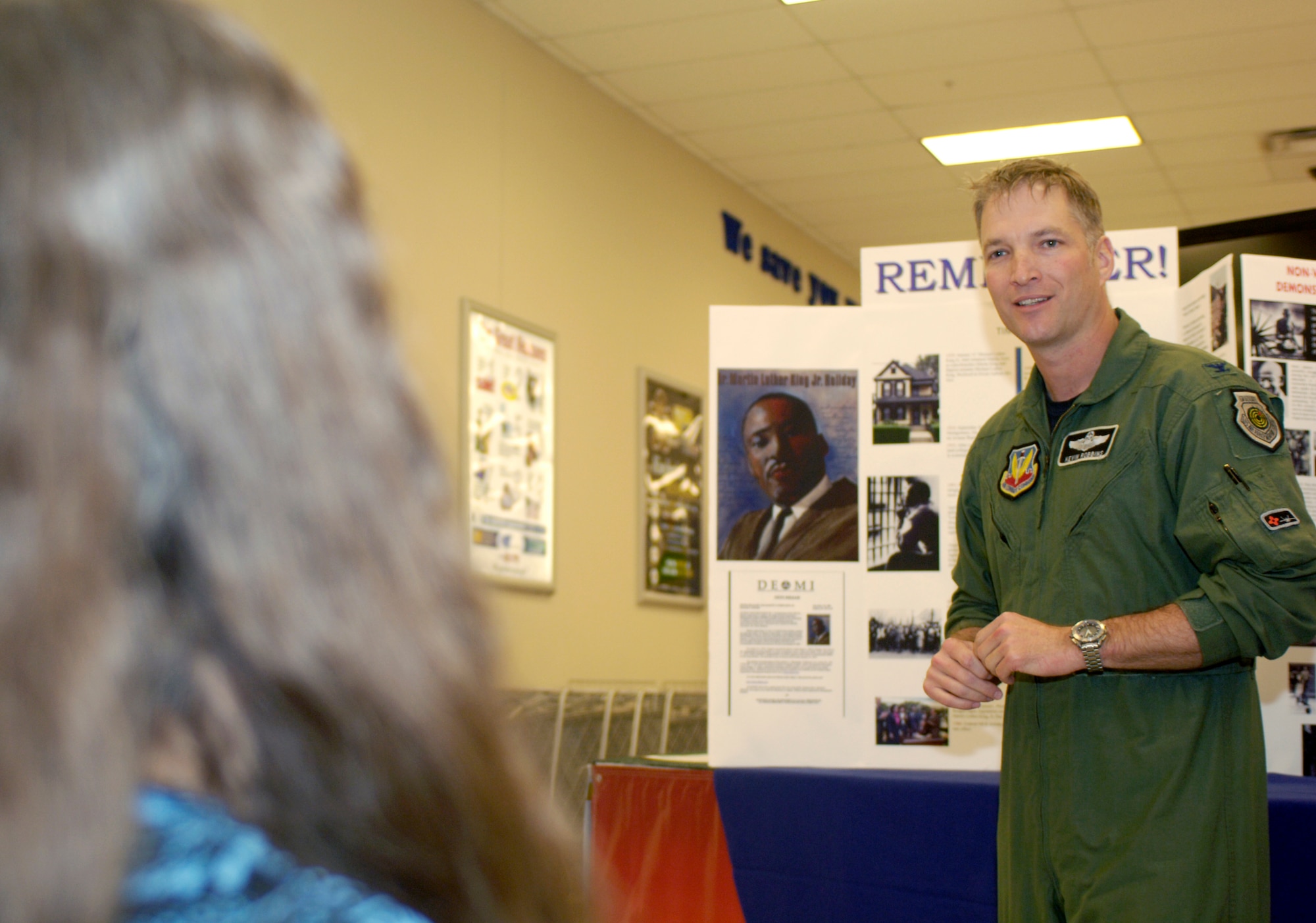 HOLLOMAN AIR FORCE BASE, N.M. -- Col. Kevin Robbins, 49th Fighter Wing vice commander, shares his thoughts during the kick-off event for the week-long Martin Luther King, Jr. observance at the Base Exchange, Jan. 12. Members from Team Holloman gathered around a display of information and listened while Holloman members gave their thoughts on the prominent leader through spoken word and a video. (U.S. Air Force photo by Senior Airman DeAndre Curtiss)