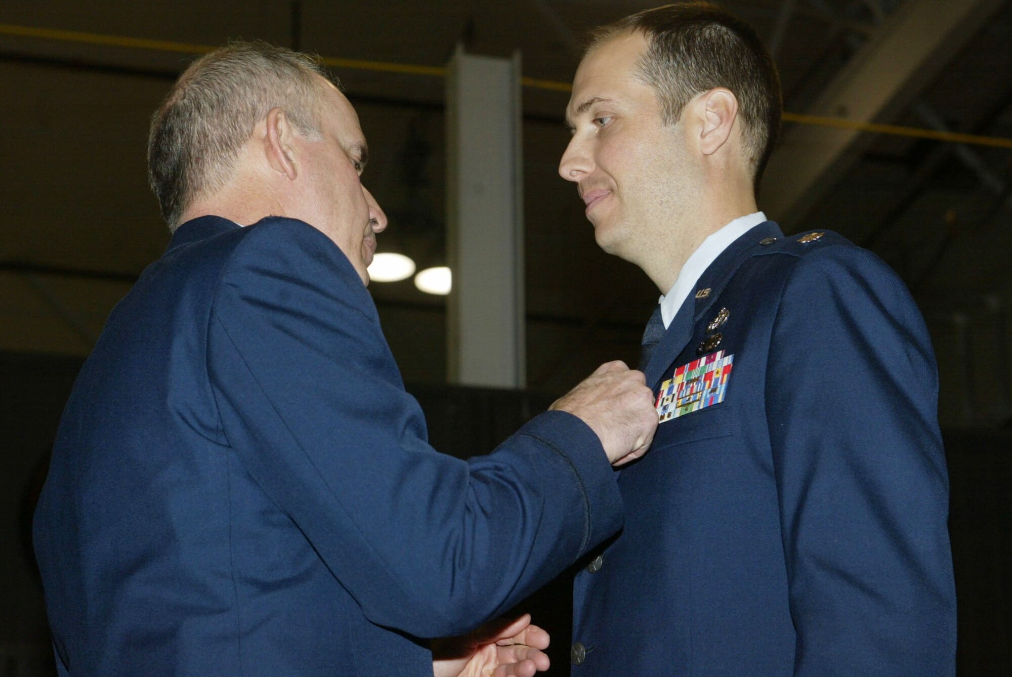 Lt. Col. Christopher Whitehead receives the Bronze Star for his efforts during his recent deployment from Colonel Steven Slick, Commander of the 94th Mission Support Group as he accepts the position of Commander of the 94th Civil Engineering Squadron at a ceremony held Jan. 10. (U.S. Air Force photo/Don Peek)