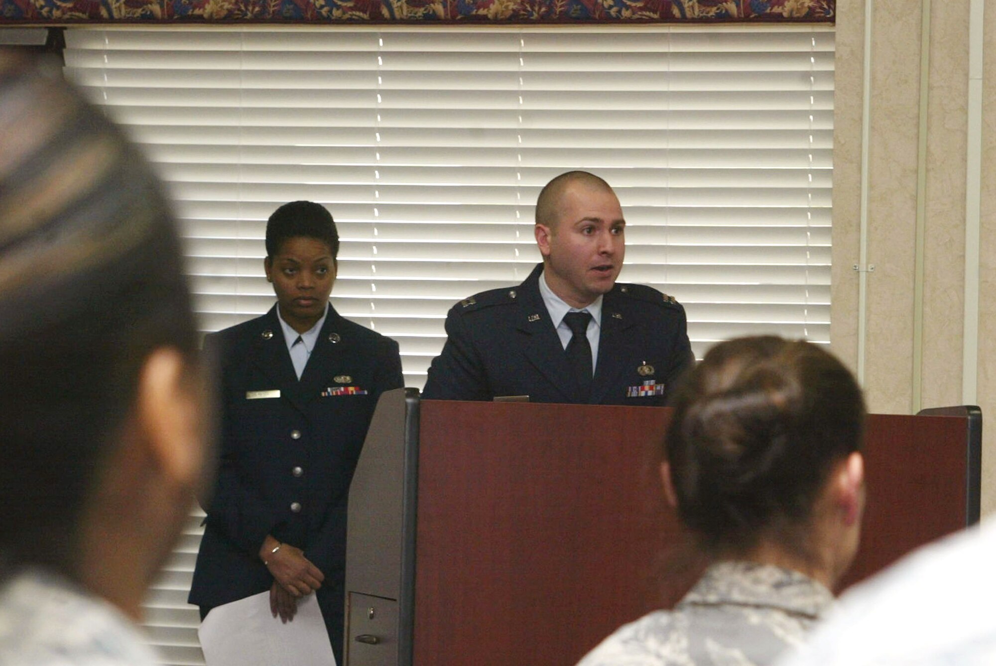 Capt. Nicholas Franz briefs members during his assumption of command ceremony held Jan. 9. Captain Franz was appointed as the new 94th Services Squadron Commander. (U.S. Air Force photo/Don Peek)