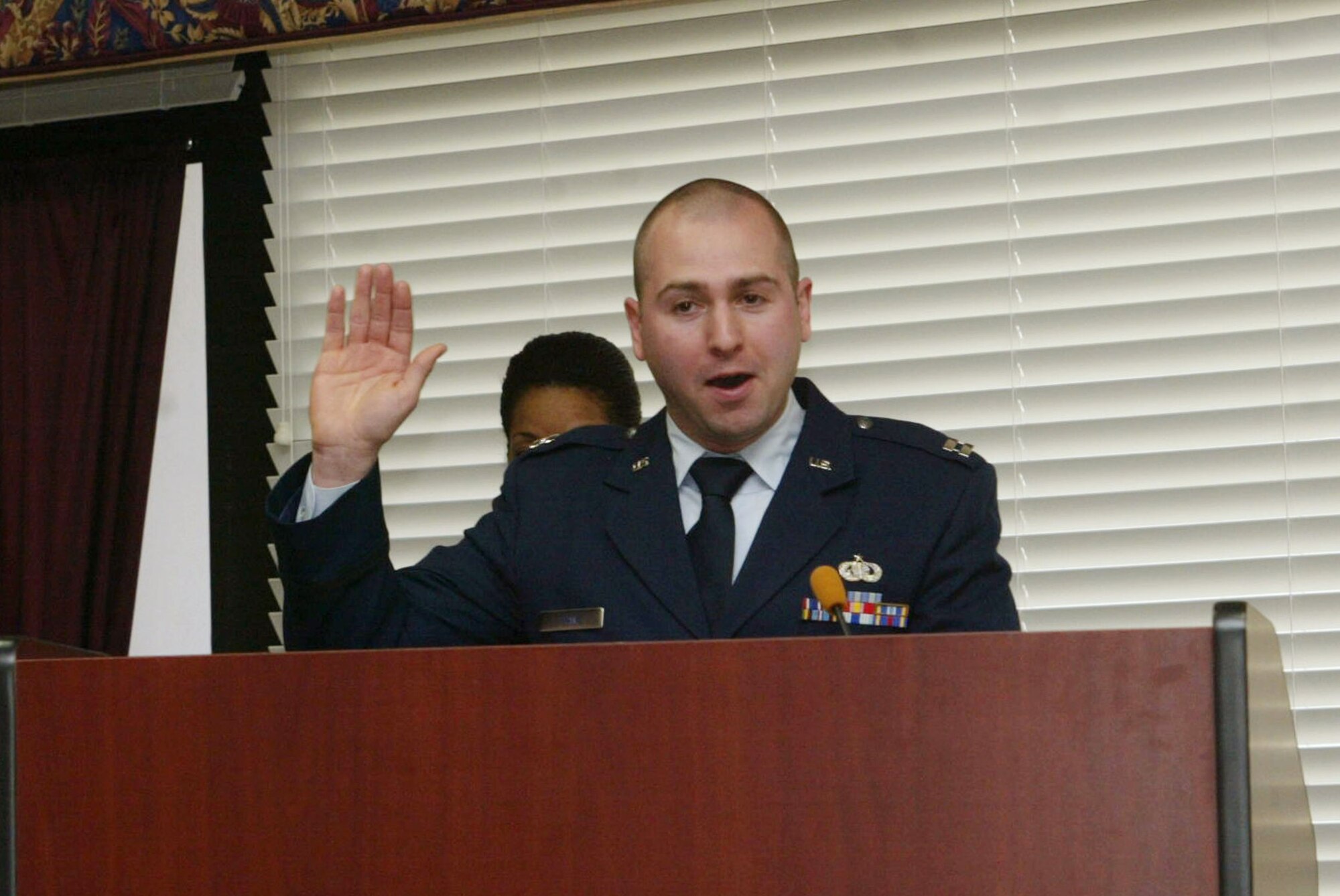 Capt. Nicholas Franz briefs members during his assumption of command ceremony held Jan. 9. Captain Franz was appointed as the new 94th Services Squadron Commander. (U.S. Air Force photo/Don Peek)