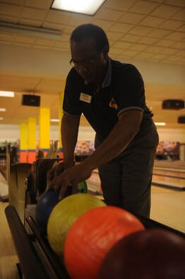 Allen Ruffin, Planet Bowl recreation supervisor, returns bowling balls to their racks as part of his daily shift on Seymour Johnson Air Force Base, Jan. 7, 2010.  Ruffin began his career here at the age of 19 and worked alongside his father for seven years. (U.S. Air Force photo/Senior Airman Ciara Wymbs)