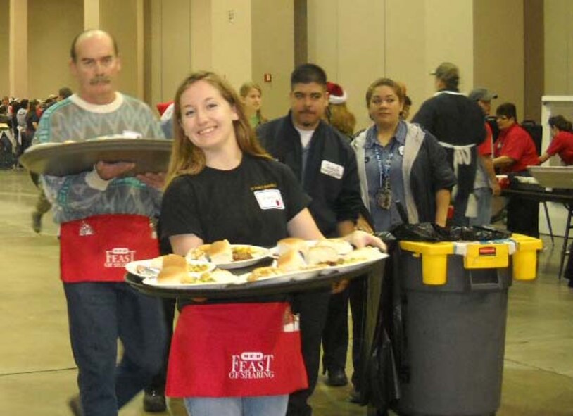 433rd Airlift Wing resirvists and their family members, in conjunction with the Alamo Wing Human Relations Development Council, participate in the annual Feast of Sharing December 18, 2009 in San Antonio, Texas. 