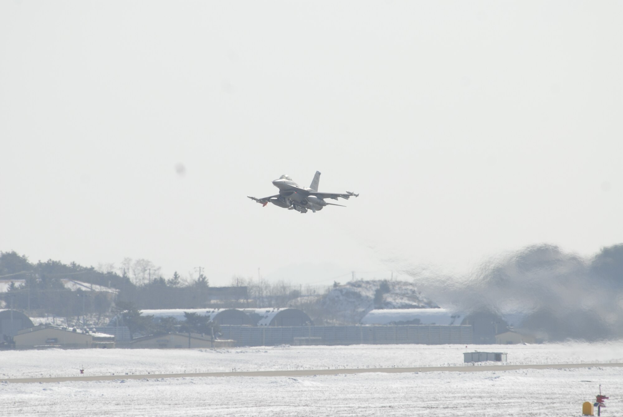 An F-16 Fighting Falcon takes off from Kunsan Air Base during a Peninsula-wide Operational Readiness Exercise here, Jan. 12. PENOREs like this one ensure that all Wolf Pack members are capable of performing their duties in wartime conditions. (U.S. photo/Staff Sgt. Darnell T. Cannady)