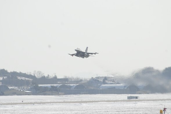 An F-16 Fighting Falcon takes off from Kunsan Air Base during a Peninsula-wide Operational Readiness Exercise here, Jan. 12. PENOREs like this one ensure that all Wolf Pack members are capable of performing their duties in wartime conditions. (U.S. photo/Staff Sgt. Darnell T. Cannady)