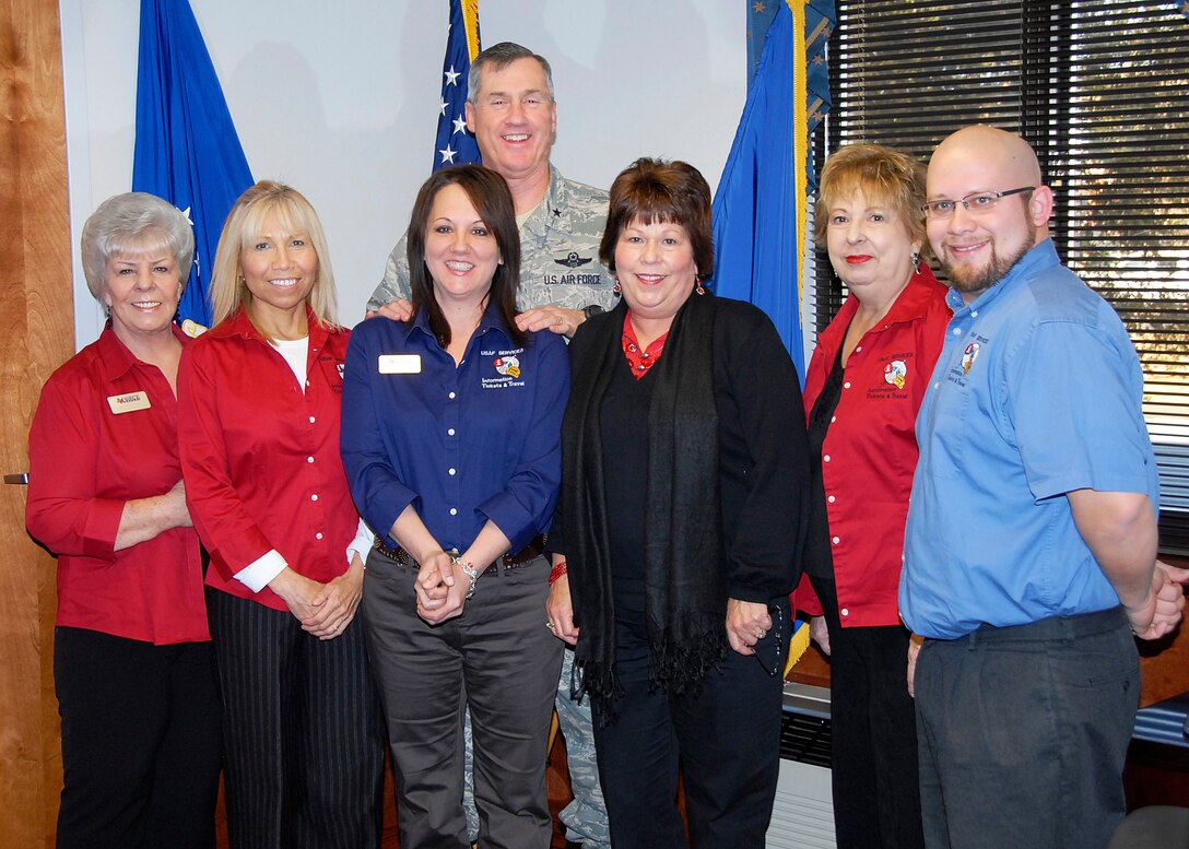 Staff members from the base Information, Travel and Tickets Office were coined Jan. 8 by Brig. Gen. O.G. Mannon (top center), 82nd Training Wing commander, for their hard work and months of planning for the 2009 Holiday Exodus. Pictured from left to right are 82nd Force Support Squadron ITT members: Travel Specialists Glenda Kephart and Cindy Corzine, ITT Director Marnie Thomas, Flight Chief Cindy Perpich, Travel Specialist Suzanne Huffer and ITT Operations Clerk Joshua Wood. 
(U.S. Air Force photo/Harry Tonemah)
