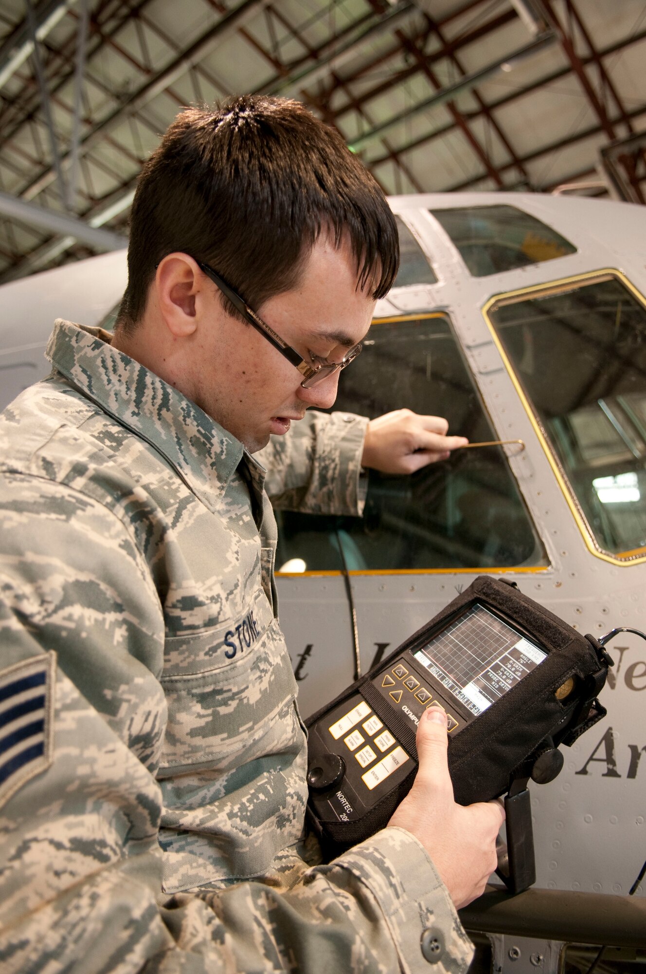 Staff Sgt. Danny Stone, Nondestructive Inspections Technician with the 130th Maintenance Squadron, Yeager Airfield, Charleston, W.Va., uses eddy current to scan the flight deck window mounting frames and post skin doublers of a WC-130H Hercules aircraft, Saturday, Jan. 9, 2010. The West Virginia Air National guard is contracted to perform a variety of maintenance on the WC-130H which belongs to the 125th Fighter Wing, Florida Air National Guard. (U.S. Air Force photo by Tech. Sgt. Eugene Crist/Released)