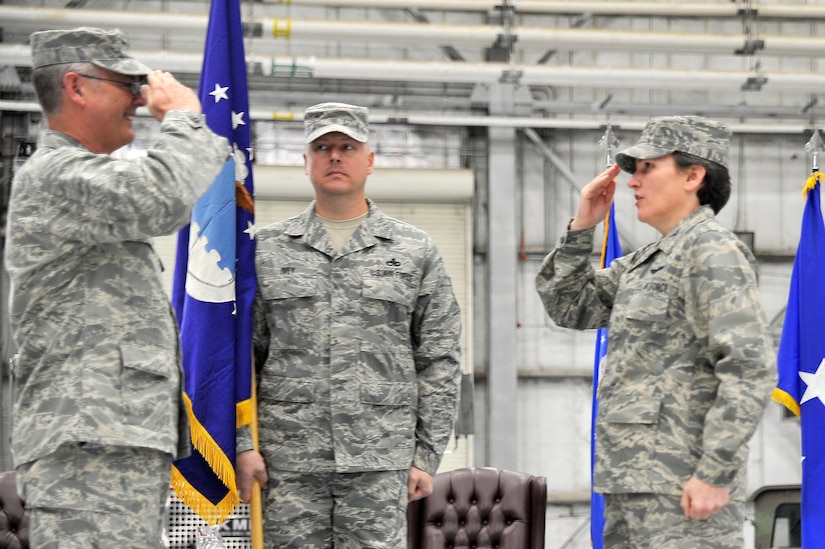 Lt. Gen. Robert Allardice, left, gives command of the 628th Air Base Wing to Col. Martha Meeker, right, during the 628 ABW activation ceremony here Jan. 8. The assumption of command served as a key moment in Charleston AFB's ongoing transition into Joint Base Charleston. General Allardice is the 18th Air Force commander and Colonel Meeker is the 628 ABW commander. (U.S. Air Force photo/Staff Sgt. Marie Brown)