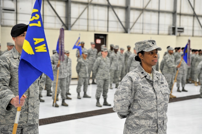 Lt. Col. Anna Morris stands at parade rest as she waits for the activation of the 628th Mission Support Group during the 628th Air Base Wing assumption of command ceremony here Jan. 8. The assumption of command served as a key moment in Charleston AFB's ongoing transition into Joint Base Charleston. Colonel Morris is the 628 MSG deputy commander. (U.S. Air Force photo/Staff Sgt. Marie Brown)