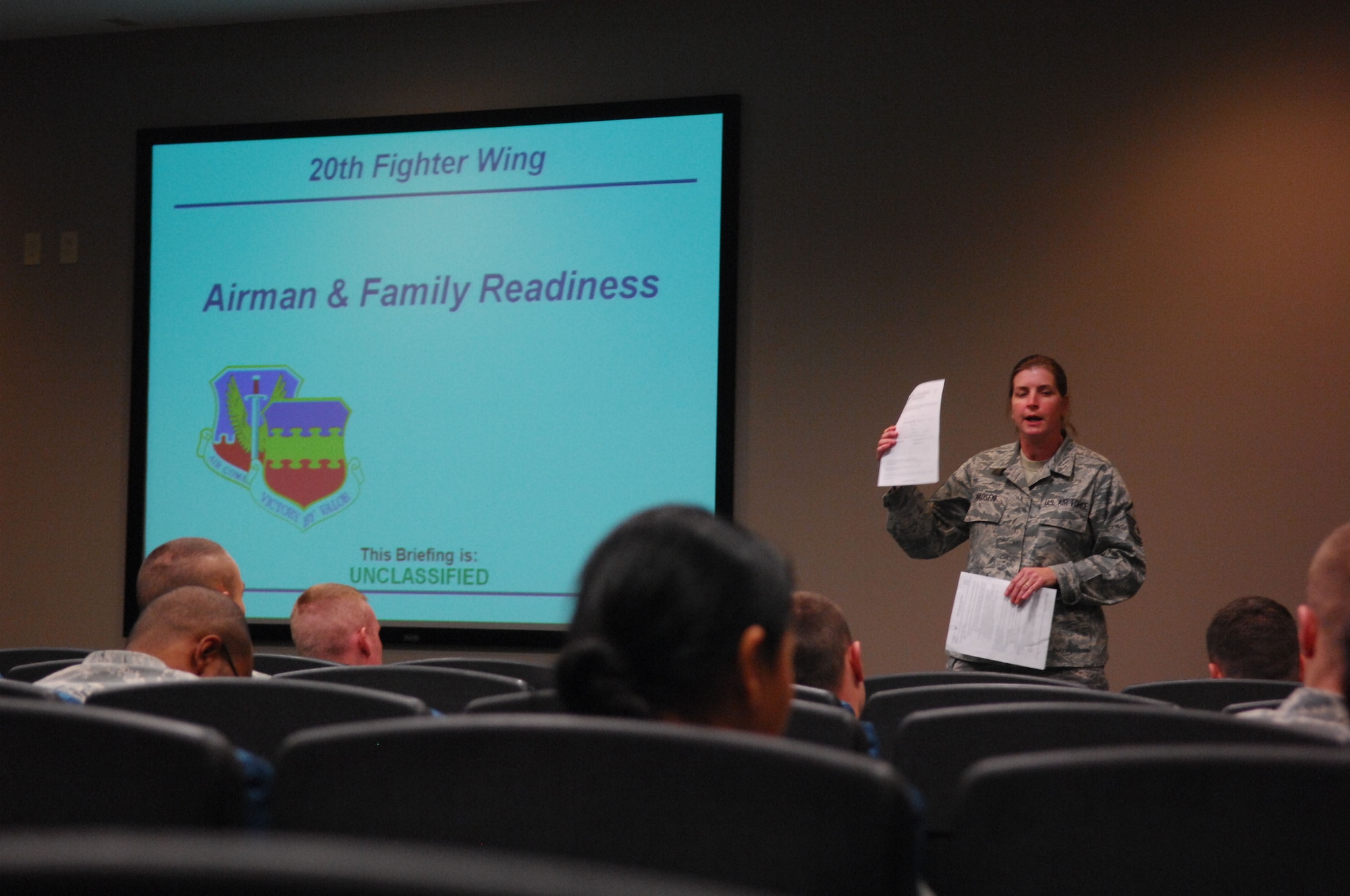 SHAW AIR FORCE BASE, S.C. -- Master Sgt. Marsha Madsen, 20th Force Support Squadron, briefs Airmen of the 77th Aircraft Maintenance Squadron about the Year of the Air Force Family and DePLAYment Program during their pre-deployment briefing Jan. 12. The DePLAYment Program offers many services for deployed member's families to support them while their loved ones are deployed. The DePLAYment package can be picked up at the Airman and Family Readiness Center here. (U.S. Air Force photo/Staff Sgt. John Gordinier)