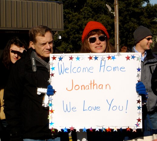 Tim and Marty Weaver wait for their son 1st Lt. Jonathan Weaver to come off of the plane on the flightline here Jan. 3. The 17th Airlift Squadron returned home from their 120-day deployment in the Middle East where they supported Operations Iraqi and Enduring Freedom as well as the Horn of Africa. Lieutenant Weaver is a pilot with the 17 AS. (U.S. Air Force photo/Trisha Gallaway)