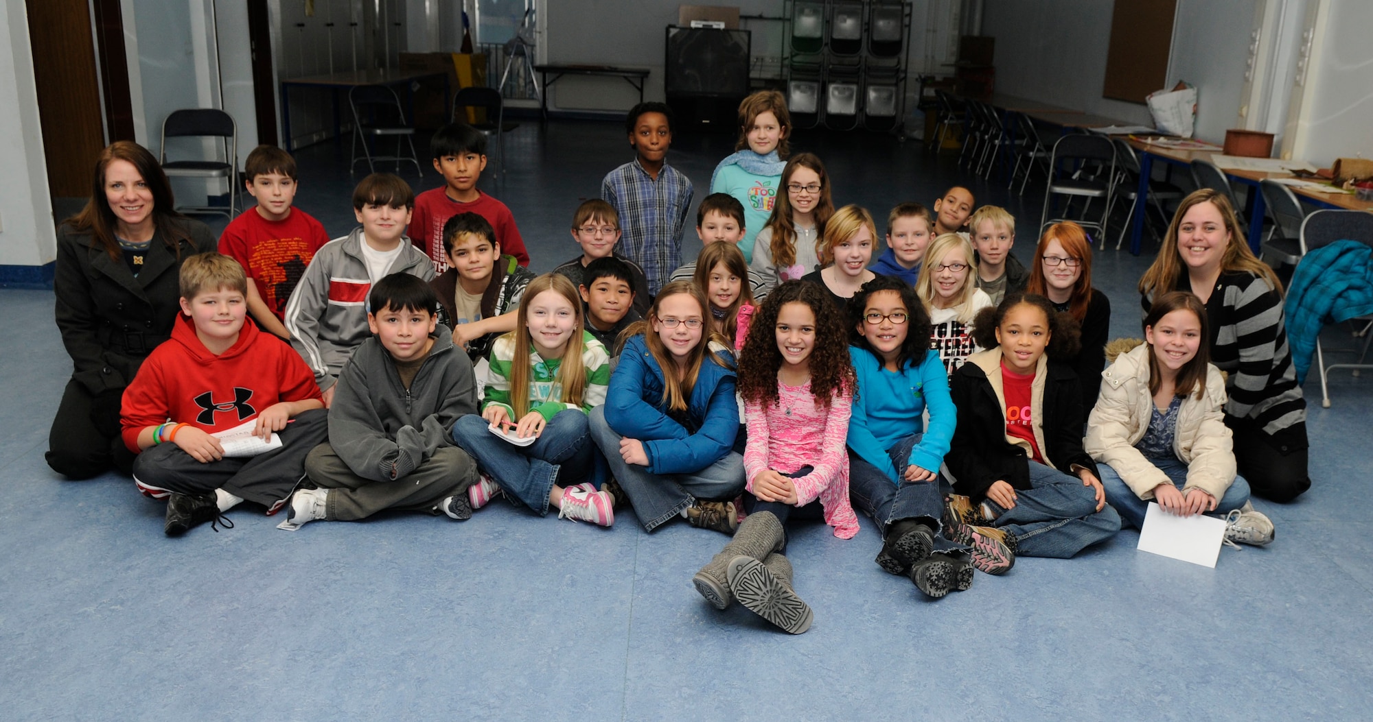 Ms. Madison Pettis, child actress, poses with a class at Ramstein Intermediate School on Ramstein Air Base, Germany, Dec. 5, 2010. Ms. Pettis' visit to the school, sponsored by the United Services Organization, included an answer/question session and autographs with four hundred 4th and 5th graders. (U.S. Air Force photo by Airman 1st Class Brittany Perry)