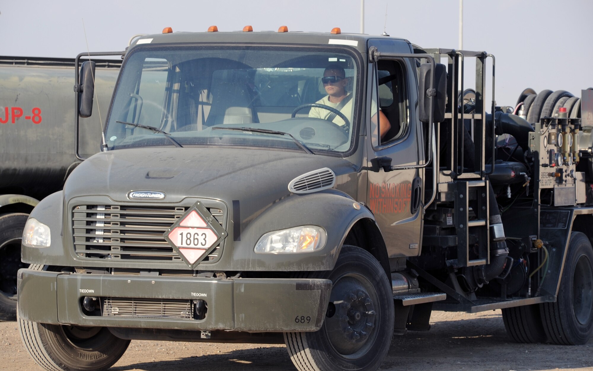 Airman Jose Goitia, fuels distribution apprentice with the 380th Expeditionary Logistics Readiness Squadron fuels management flight, drives an R-12 fuel truck during operations at a non-disclosed base in Southwest Asia on Jan. 6, 2010.  On any given day, Airman Goitia and other fuels Airmen in his flight can off-load up to 600,000 gallons of fuel from host nation supplier fuel trucks.  In 2009, the 380th ELRS fuels management flight pumped more than 188 million gallons of fuel in support of Operations Iraqi Freedom and Enduring Freedom and the Combined Joint Task Force-Horn of Africa.  Airman Goitia is deployed from the 97th Logistics Readiness Squadron at Altus Air Force Base, Okla., and his hometown is Chicago, Ill.  (U.S. Air Force Photo/Tech. Sgt. Scott T. Sturkol/Released)