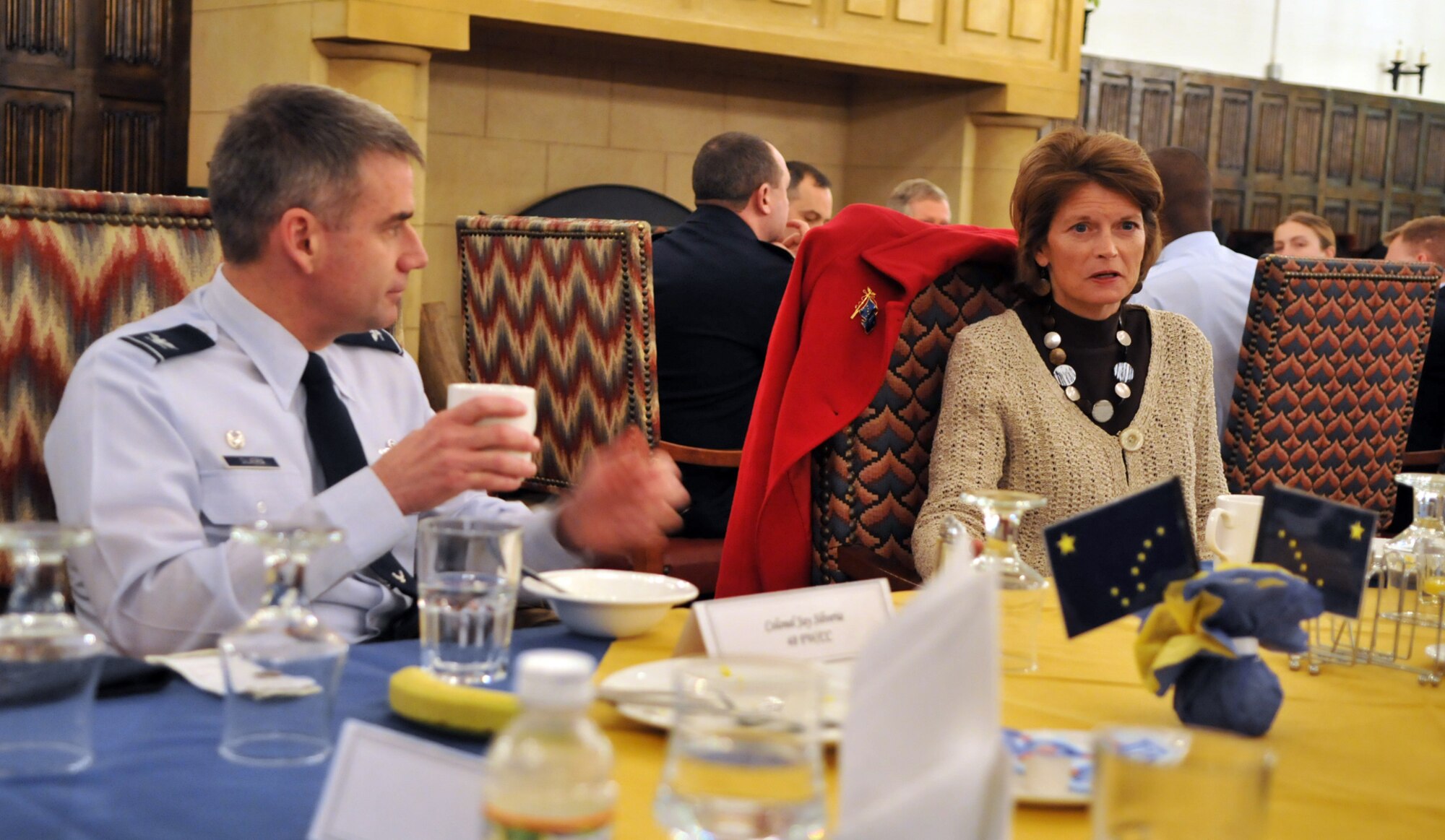 RAF MILDENHALL, England -- Col. Jay Silveria, 48th Fighter Wing commander, chats with Alaska Sen. Lisa Murkowski at a breakfast meeting here Jan. 11.  Mrs. Murkowski and four other senators sat down at the Gateway Dining Facility to talk to Airmen from their home states about issues affecting military members.  (U.S. Air Force photo by Staff Sgt. Austin M. May)