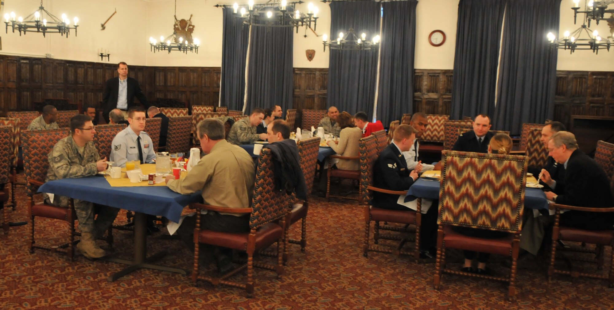 RAF MILDENHALL, England -- Airman from RAF Mildenhall and RAF Lakenheath visit with Senators from their home states at the Gateway Dining Facility here Jan. 11.  Five senators, on their way home from a trip to the Middle East, stopped to have breakfast with Airmen and answer their questions. (U.S. Air Force photo by Staff Sgt. Austin M. May)