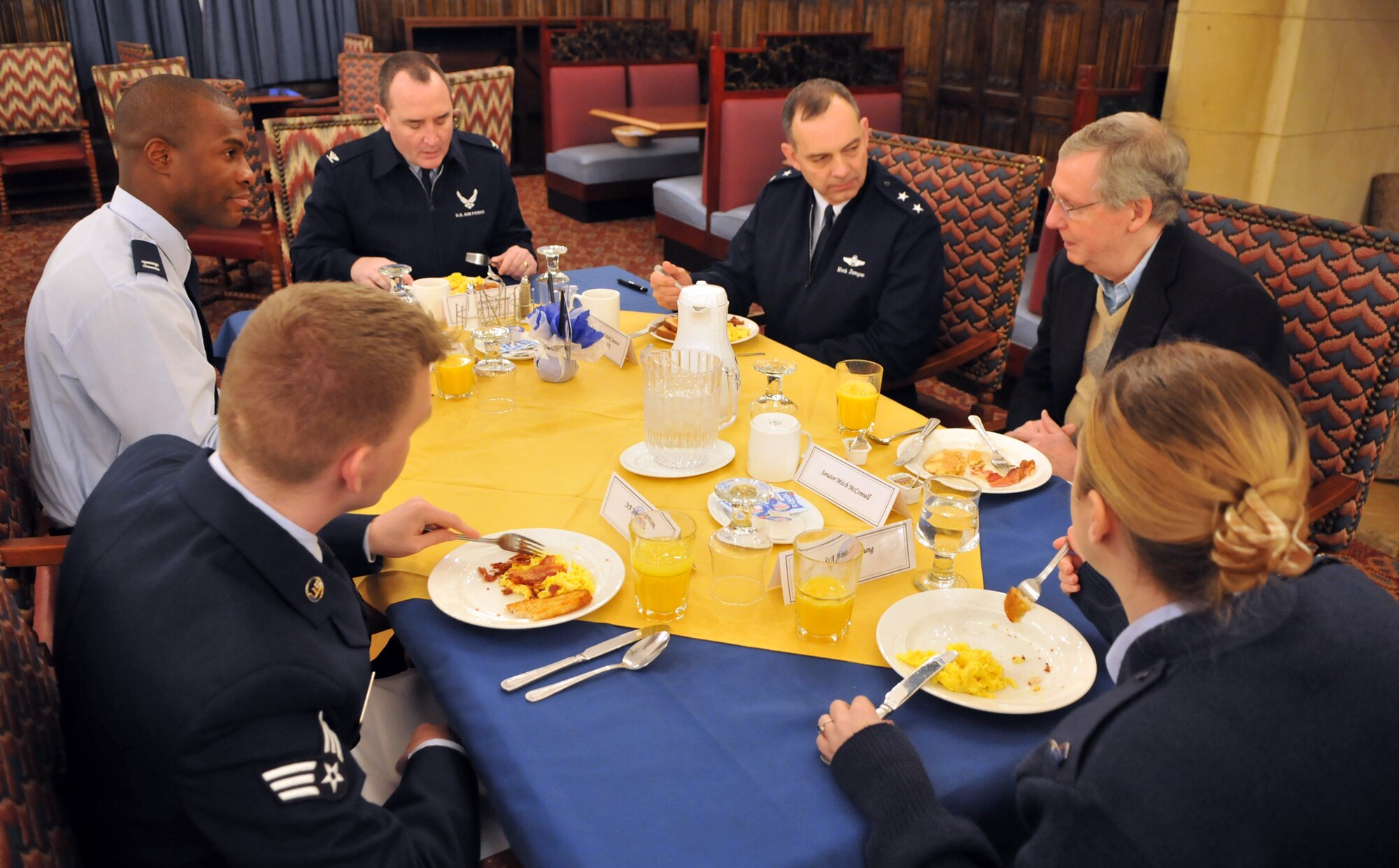 RAF MILDENHALL, England -- Airman from Kentucky enjoy breakfast and conversation with Kentucky Sen. Mitch McConnell Jan. 11.  Mr. McConnell was one of five senators who sat down with military members from his state to discuss popular topics and answer questions.  The senators were returning to the United States from a trip to the Middle East. (U.S. Air Force photo by Staff Sgt. Austin M. May)